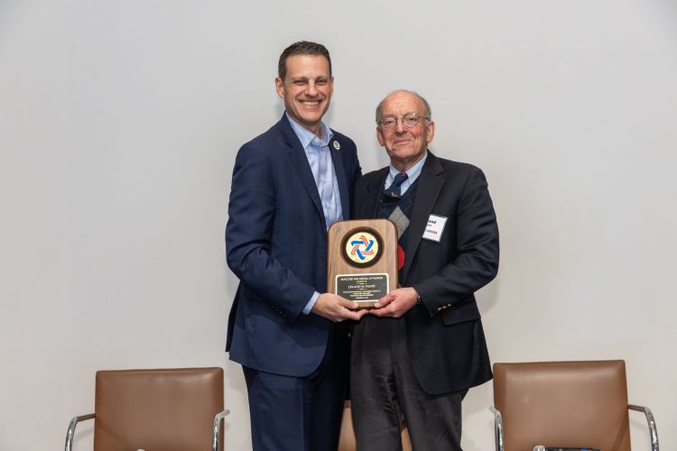 Marshall Einhorn gives MOH plaque to Leland Faust