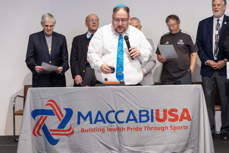 Rabbi Ami Monson lights candle