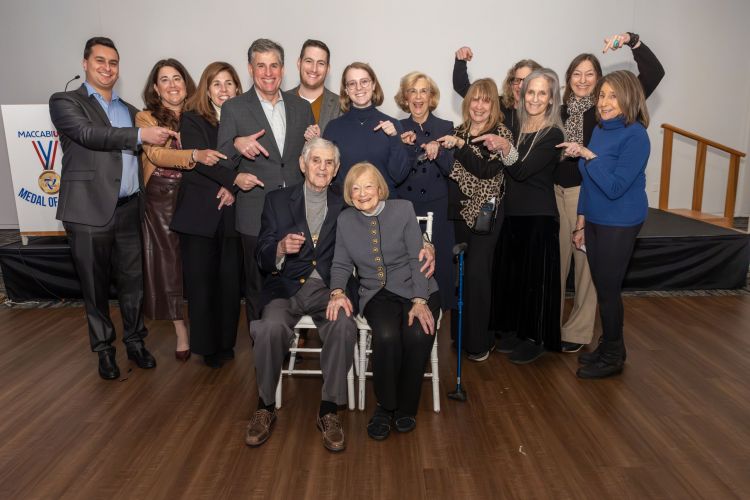 Simon Atlas family with everyone pointing at him