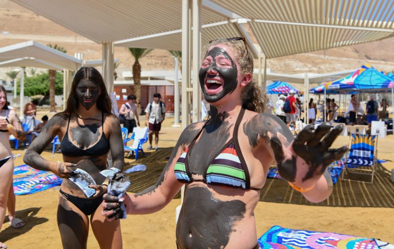 Girl laughing covered in mud pose at Dead Sea DSC_8264