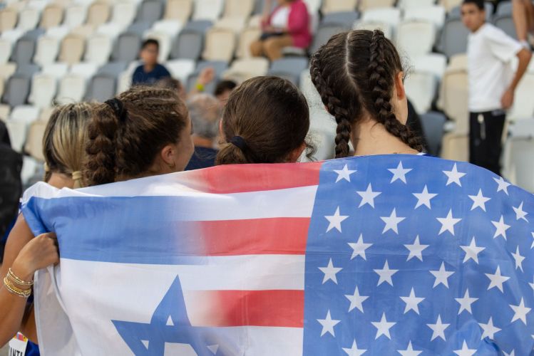 Track girls draped in USA ISR mixed flag IMGL3293